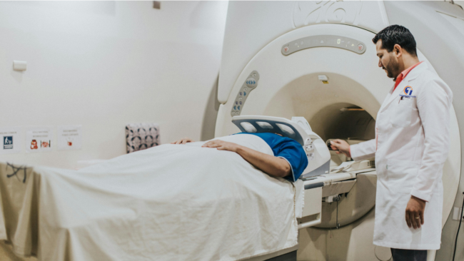 MRI Image for Blog ARRT Clinic Update MRI technologist assisting a patient in MRI scanner – ARRT clinical experience requirements 2025