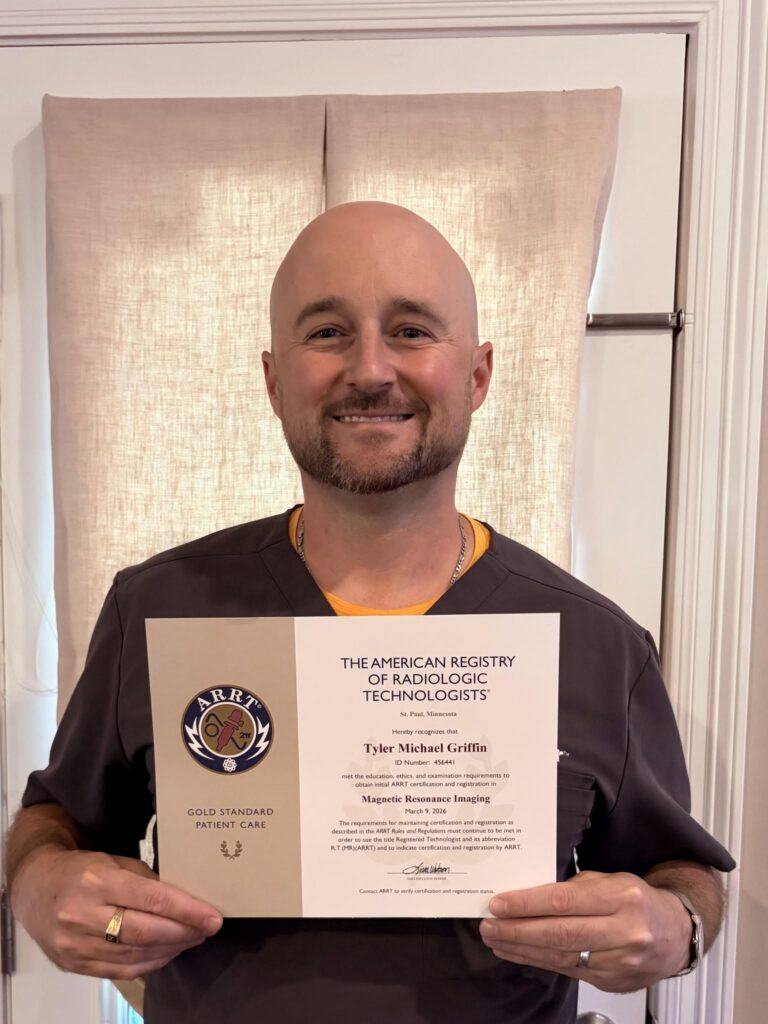 Thomas Institute of Health Professions Student Holding his ARRT CT Certification