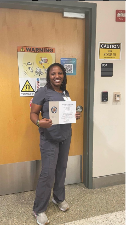 Thomas Institute of Health Professions Student Holding ARRT MRI Certificate